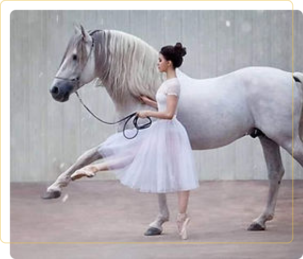 A woman in white dress leading a horse.